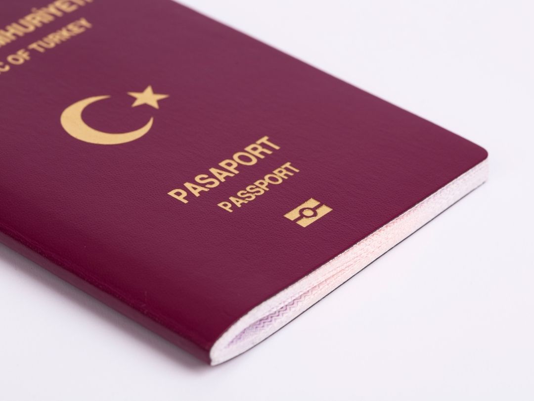 Turkish passport, title deed, and modern Istanbul skyline